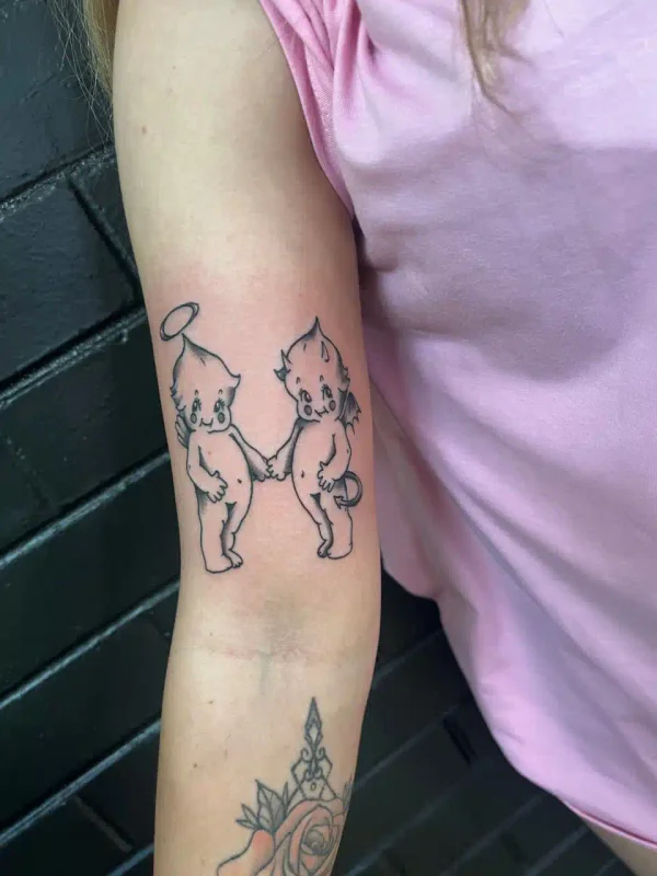 Pair of fine-line characters tattooed on an arm